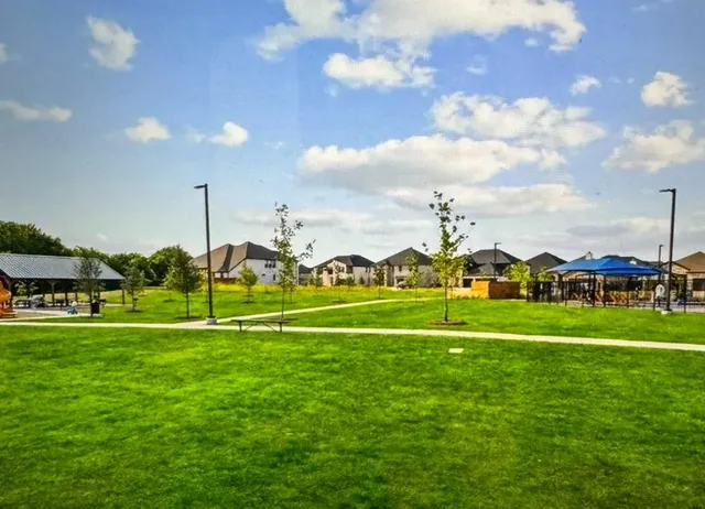 a view of a lake with a house in the background