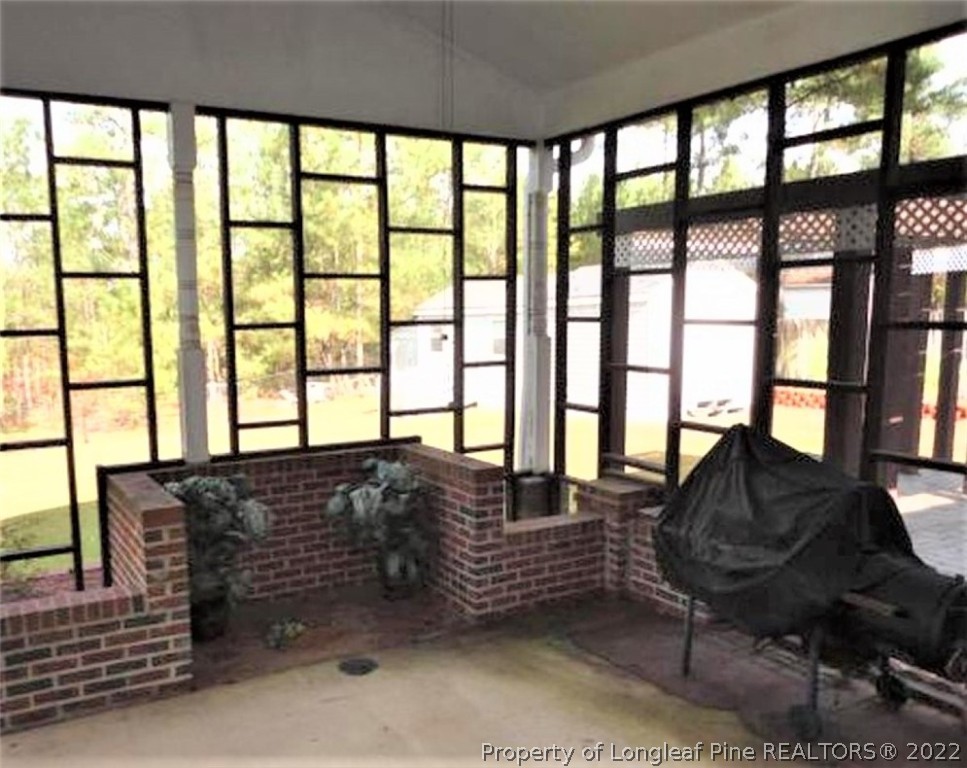 380 Ridge View Drive Cameron, NC 28326 - Photo 2 of 6 a living room with furniture and a floor to ceiling window