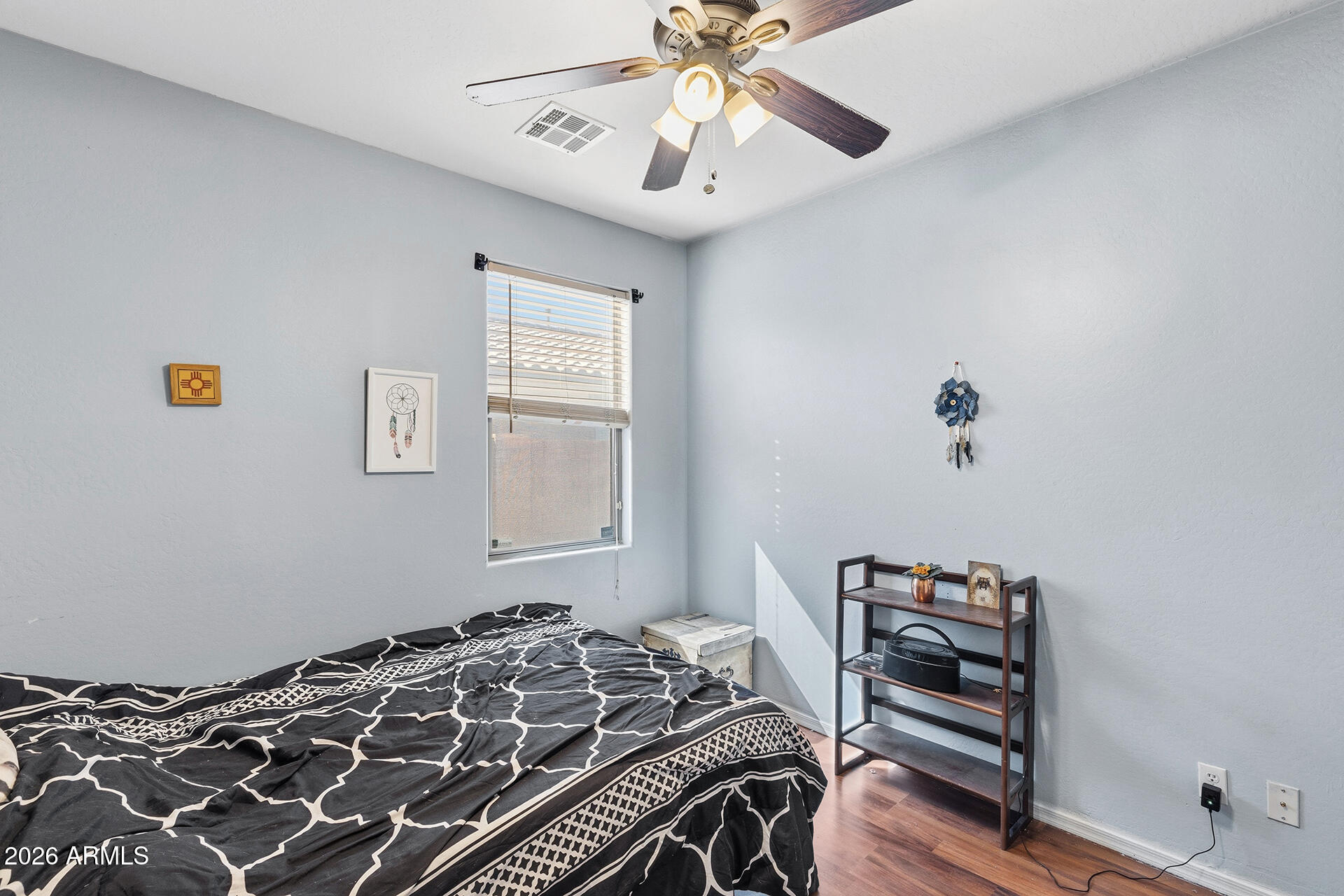 6718 West Darrel Road Laveen, AZ 85339 - Photo 17 of 49 a bedroom with a bed and a chandelier