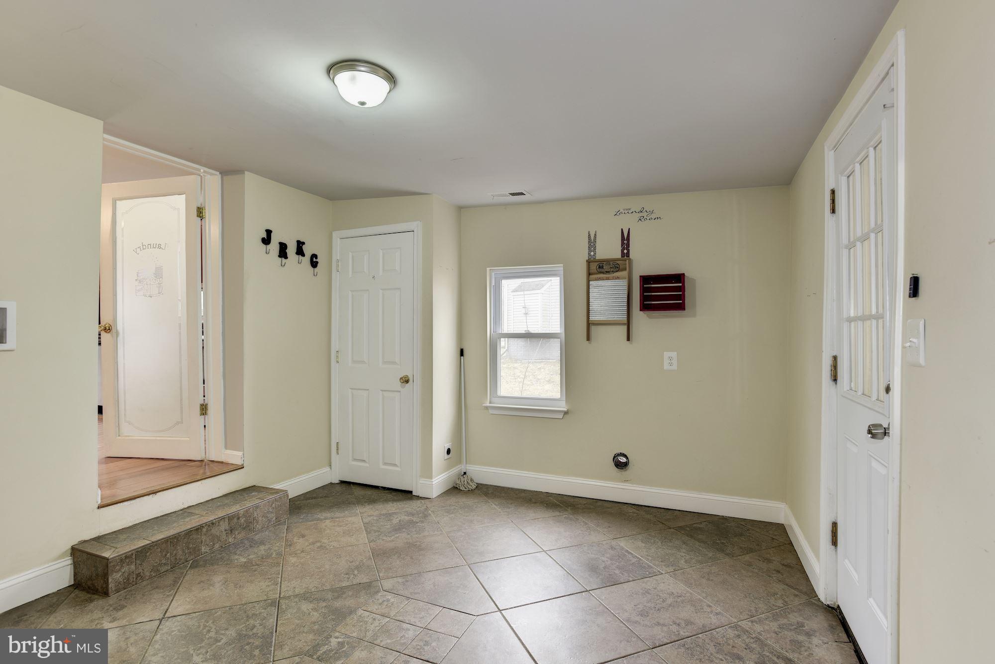 3220 Rolling Rd. Baltimore, MD 21244 - Photo 15 of 28 a view of an empty room with a window