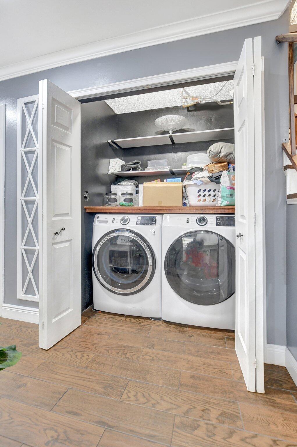 23398 Southwest 54th Way, Unit A Boca Raton, FL 33433 - Photo 16 of 29 a utility room with stainless steel appliances washer and dryer