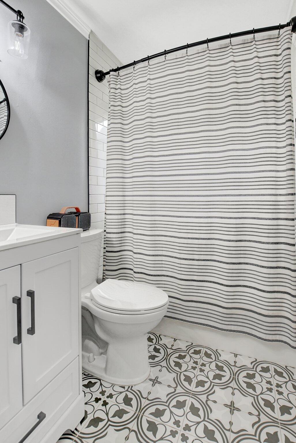 23398 Southwest 54th Way, Unit A Boca Raton, FL 33433 - Photo 23 of 29 a bathroom with a sink a toilet and a shower