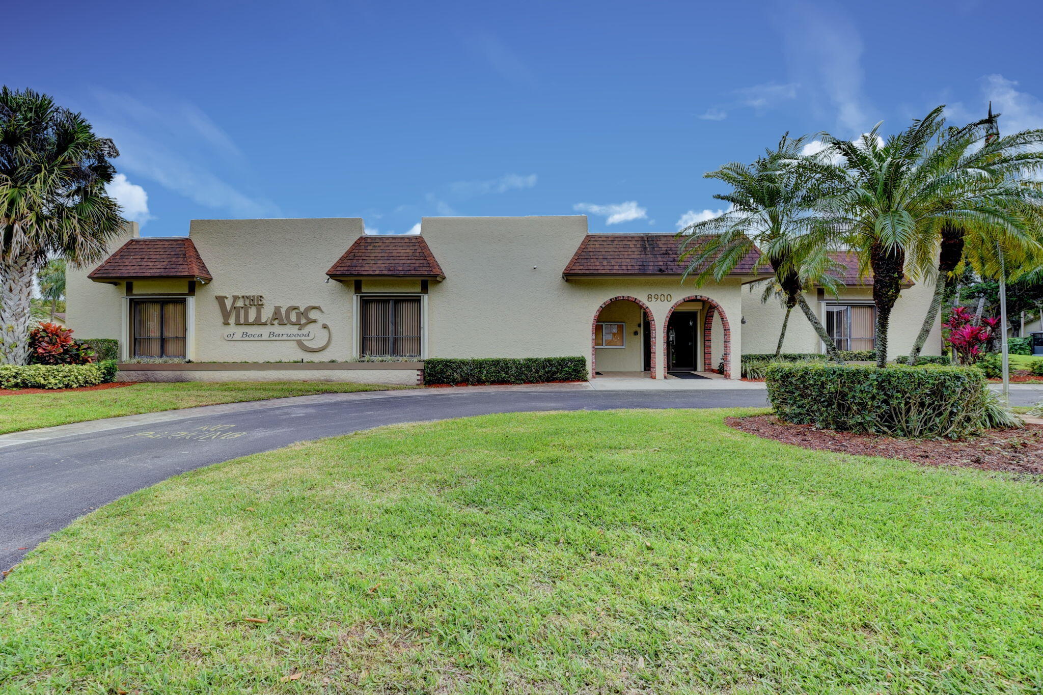 23398 Southwest 54th Way, Unit A Boca Raton, FL 33433 - Photo 24 of 29 a front view of a house with a garden and yard