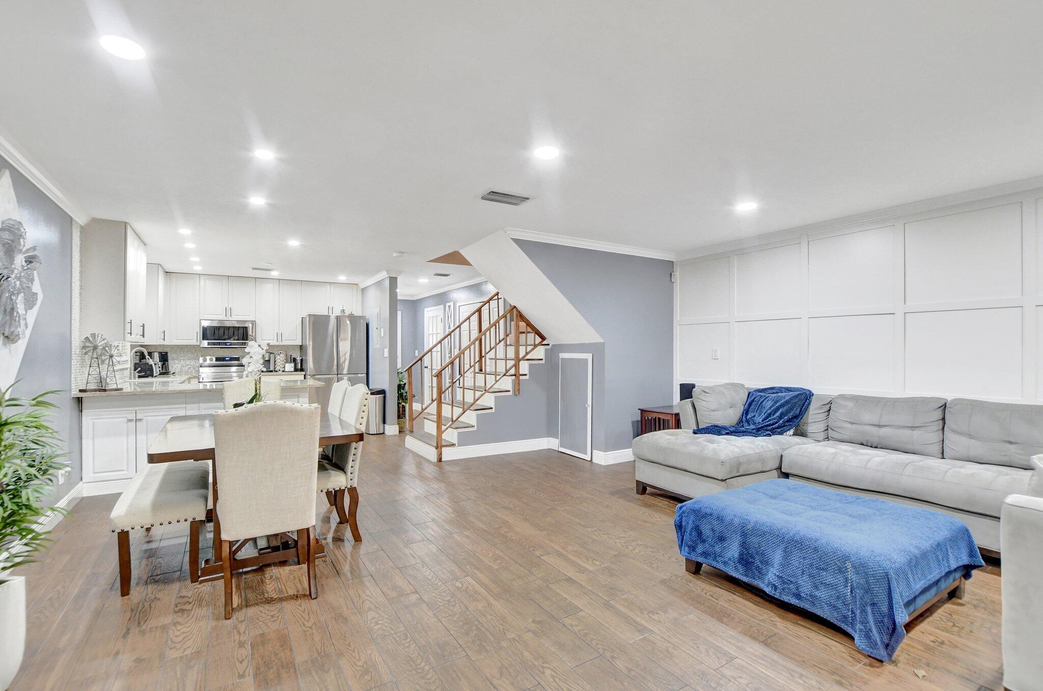 23398 Southwest 54th Way, Unit A Boca Raton, FL 33433 - Photo 8 of 29 a living room with furniture and a wooden floor