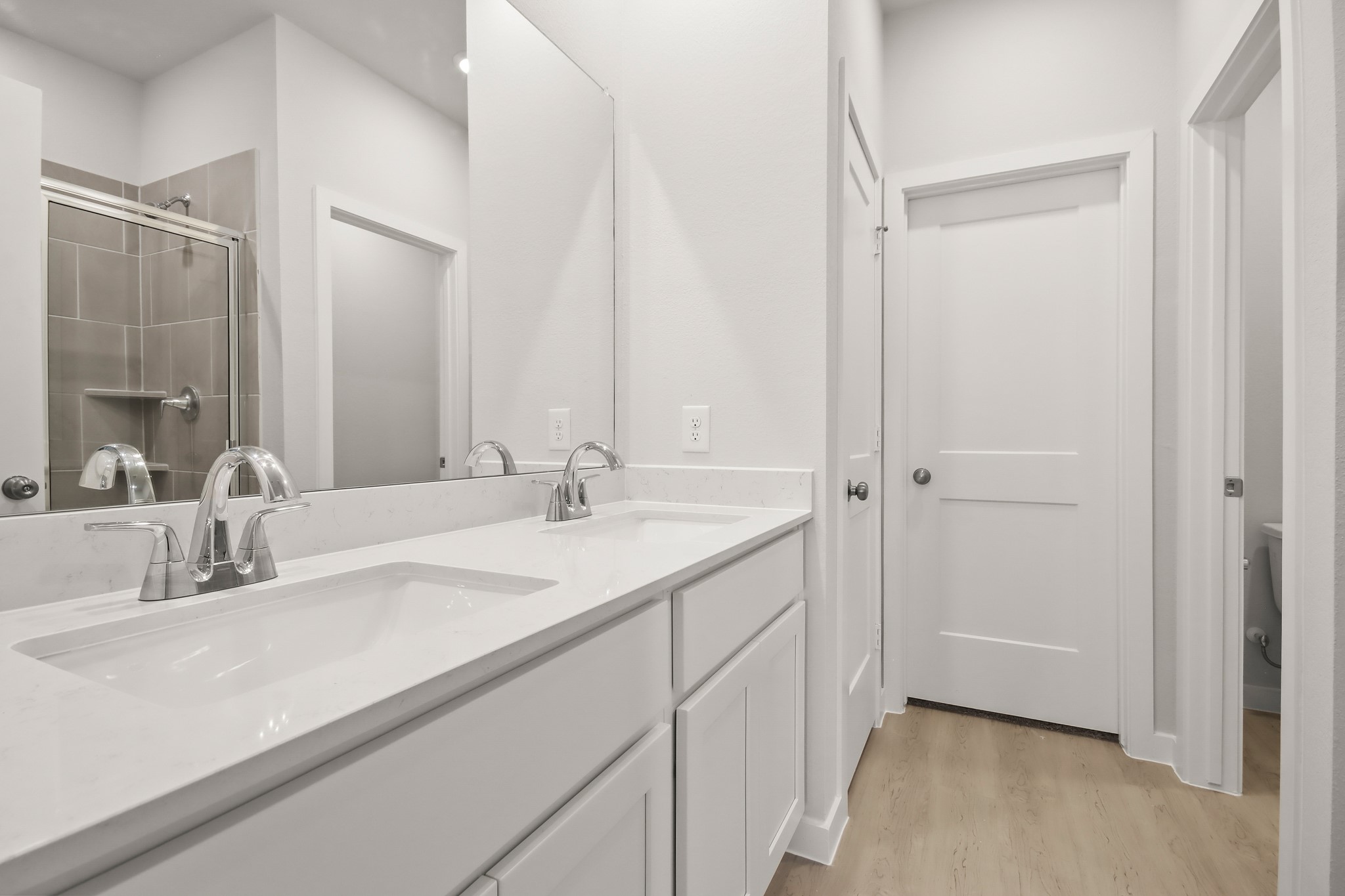 229 Spring Drive Hockley, TX 77447 - Photo 12 of 26 a bathroom with a sink and a mirror