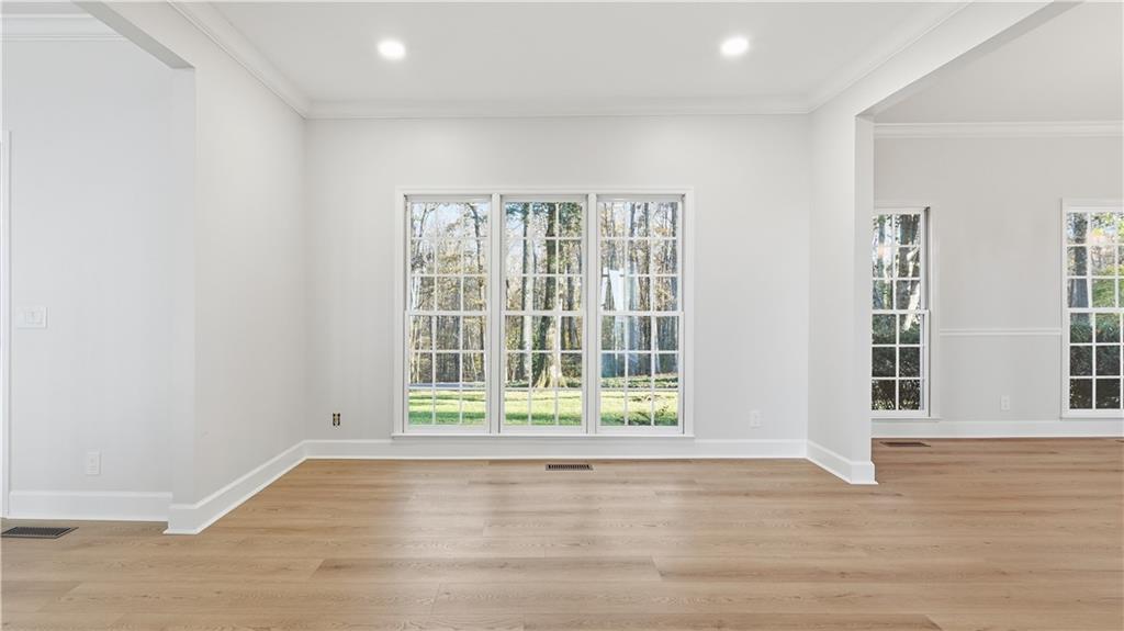 141 Brow Lake Road Lookout Mountain, GA 30750 - Photo 12 of 66 a view of an empty room with wooden floor and a window