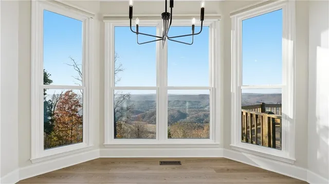 a kitchen with stainless steel appliances granite countertop a sink and a refrigerator