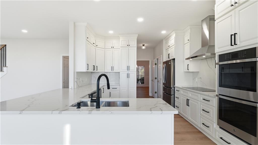 141 Brow Lake Road Lookout Mountain, GA 30750 - Photo 18 of 66 a kitchen with stainless steel appliances granite countertop a sink stove and refrigerator