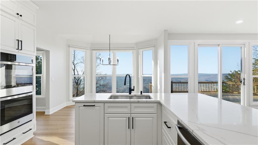 141 Brow Lake Road Lookout Mountain, GA 30750 - Photo 20 of 66 a kitchen with stainless steel appliances granite countertop a sink and a refrigerator