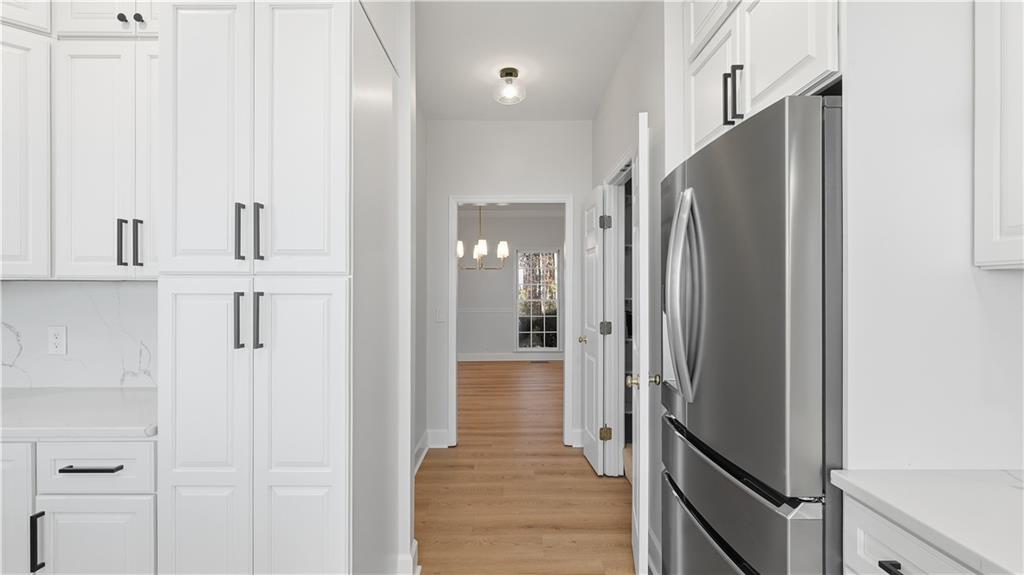 141 Brow Lake Road Lookout Mountain, GA 30750 - Photo 22 of 66 a view of a hallway with wooden floor