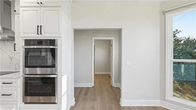 a spacious bathroom with a double vanity sink and a mirror
