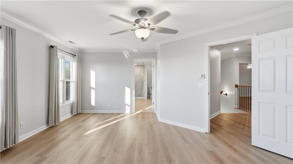 141 Brow Lake Road Lookout Mountain, GA 30750 - Photo 27 of 66 a view of an empty room with wooden floor and a ceiling fan
