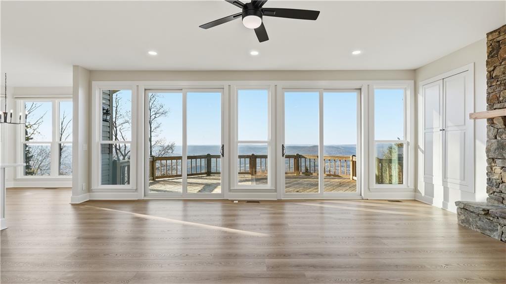 141 Brow Lake Road Lookout Mountain, GA 30750 - Photo 3 of 66 a view of an empty room with wooden floor and a window