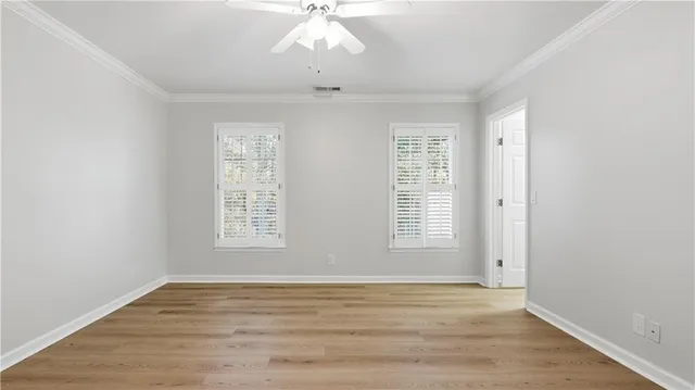 a bathroom with a shower a toilet and a sink