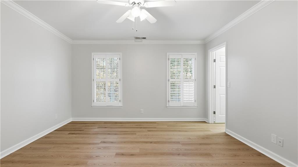 141 Brow Lake Road Lookout Mountain, GA 30750 - Photo 34 of 66 a view of an empty room with wooden floor and a window