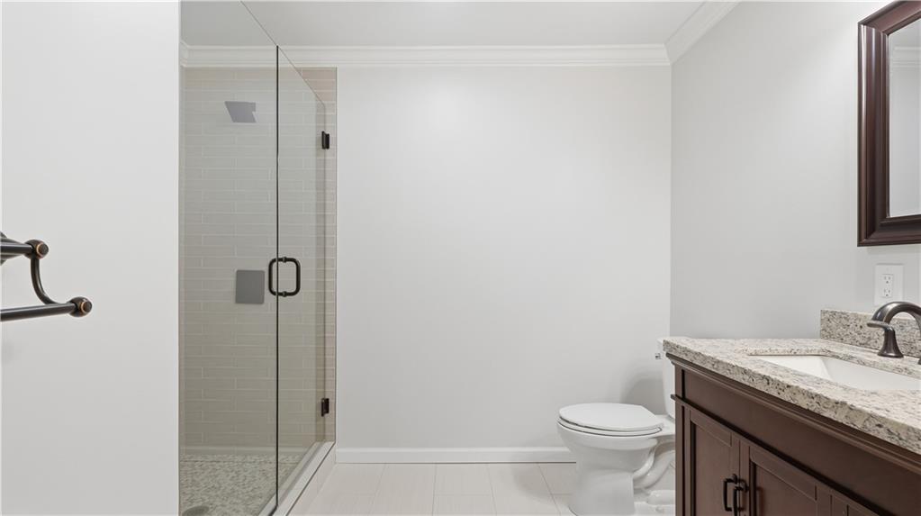 141 Brow Lake Road Lookout Mountain, GA 30750 - Photo 36 of 66 a bathroom with a granite countertop toilet and a sink