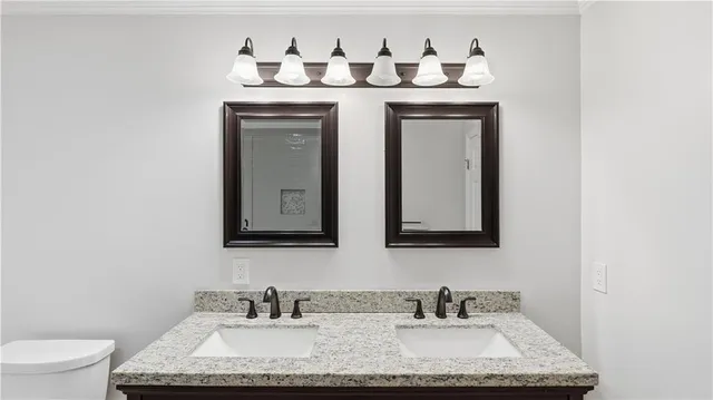 a view of a big room with wooden floor and windows