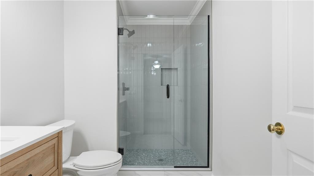 141 Brow Lake Road Lookout Mountain, GA 30750 - Photo 41 of 66 a bathroom with a shower a toilet and a sink