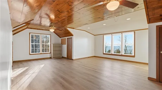 a aerial view of a house with a yard basket ball court and outdoor seating