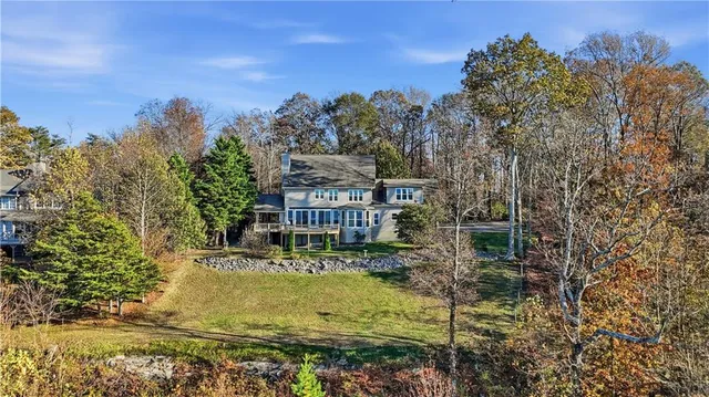 an empty room with wooden floor and a window