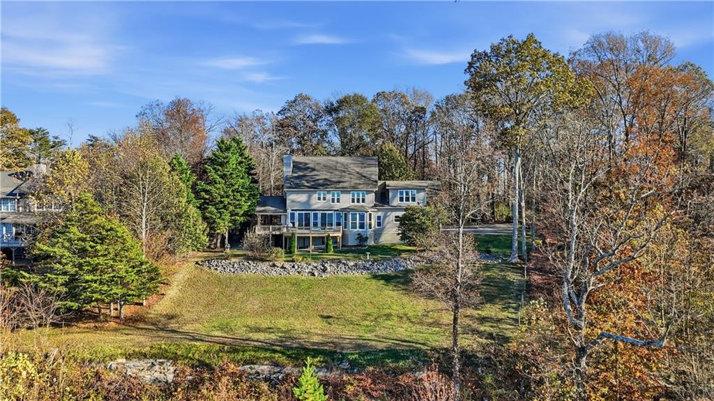 141 Brow Lake Road Lookout Mountain, GA 30750 - Photo 7 of 66 a view of a house with a yard swimming pool and sitting area