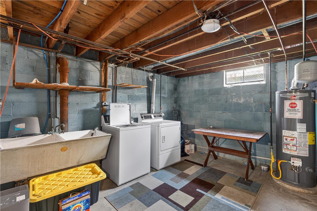 23 Harrison Street Emmaus, PA 18049 - Photo 24 of 28 A well-equipped utility area provides practical laundry solutions and ample space for household tasks.