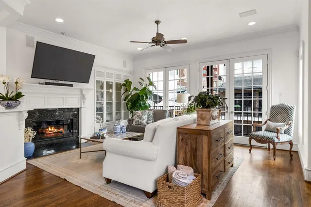 a living room with furniture fireplace and a flat screen tv