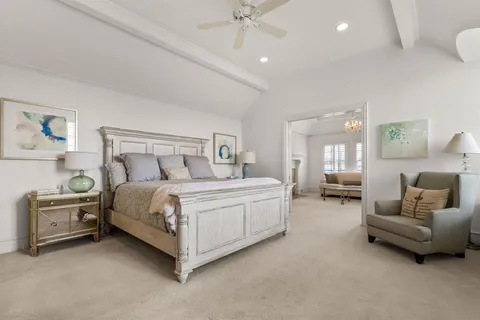 a bedroom with a bed and a couch