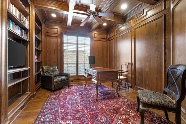 a living room with furniture a rug and a window