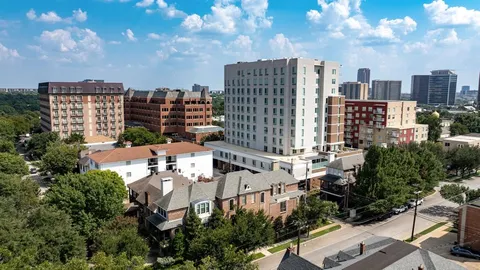 a view of a city with tall buildings