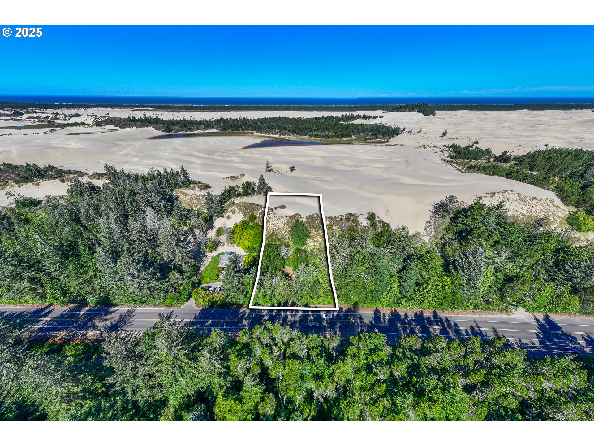 83394 Highway 101 Florence, OR 97439 - Photo 7 of 10 a view of a yard with an ocean view