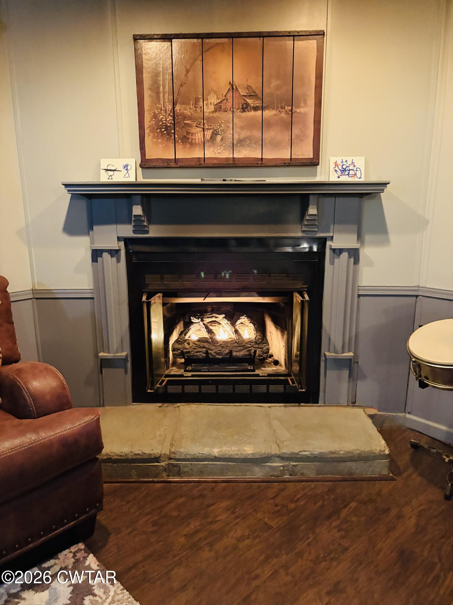 3834 Union Mercer Road Brownsville, TN 38012 - Photo 13 of 15 a living room with a fireplace and a table