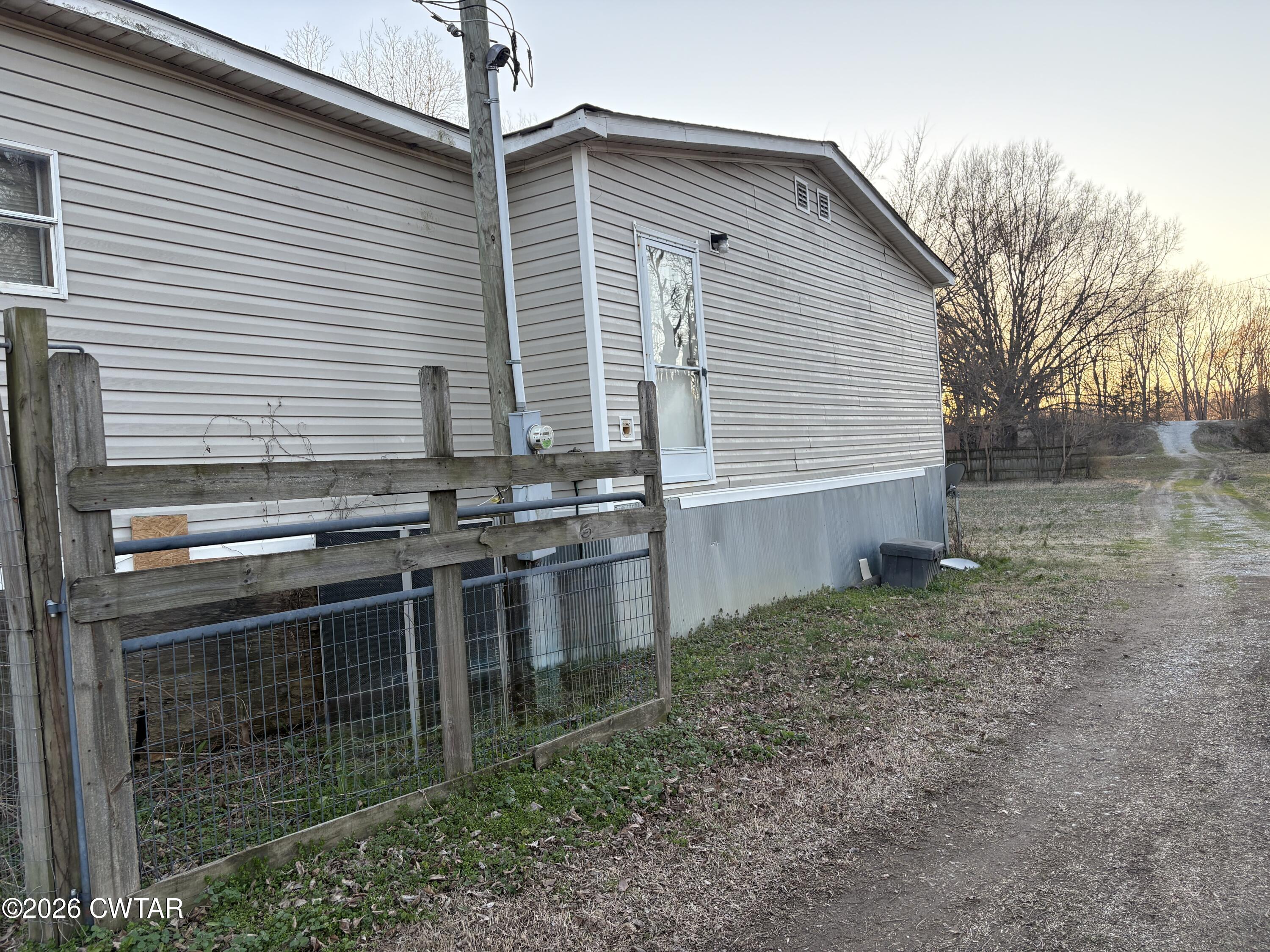 3834 Union Mercer Road Brownsville, TN 38012 - Photo 2 of 15 a backyard of a house with lots of green space