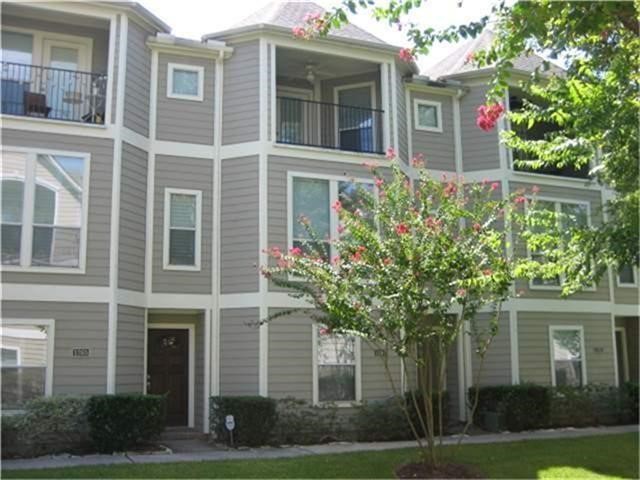 a house that has a tree in front of it