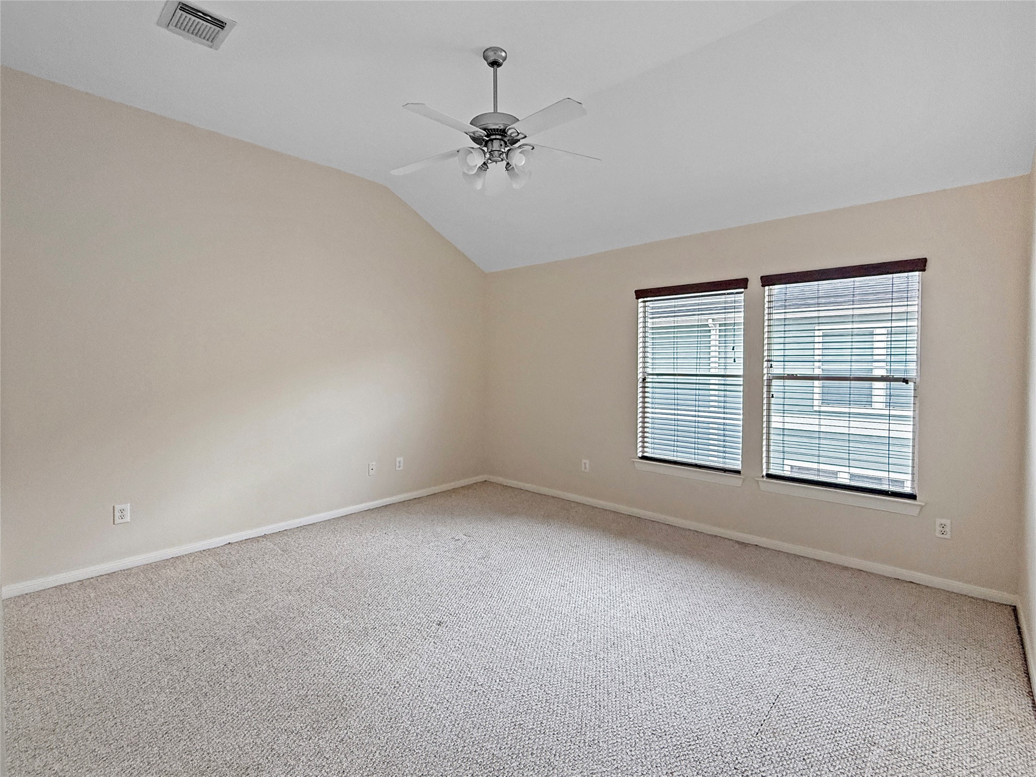 1263 West 17th Street Houston, TX 77008 - Photo 12 of 17 an empty room with a ceiling fan and windows