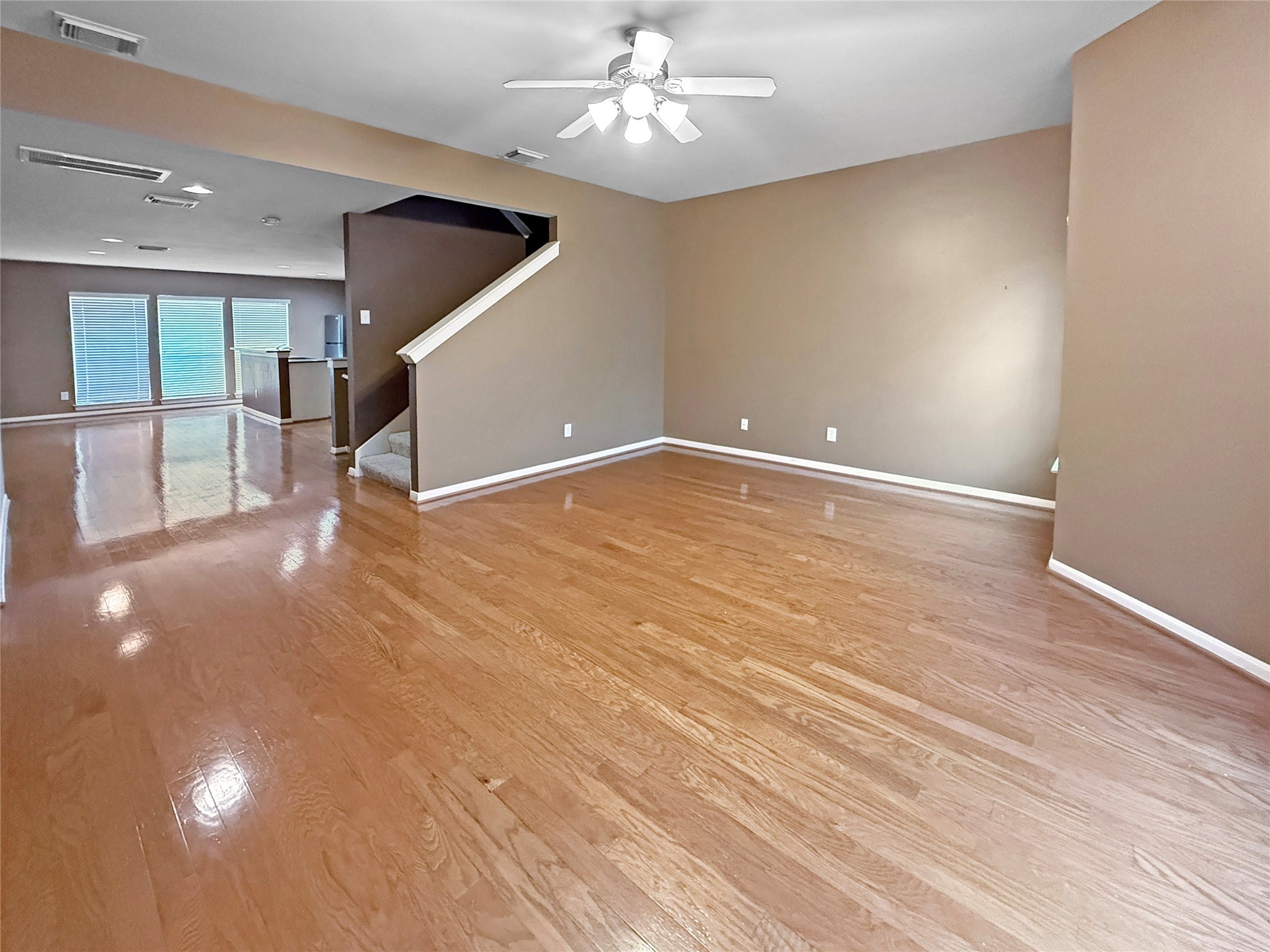 1263 West 17th Street Houston, TX 77008 - Photo 8 of 17 an empty room with wooden floor and ceiling fan