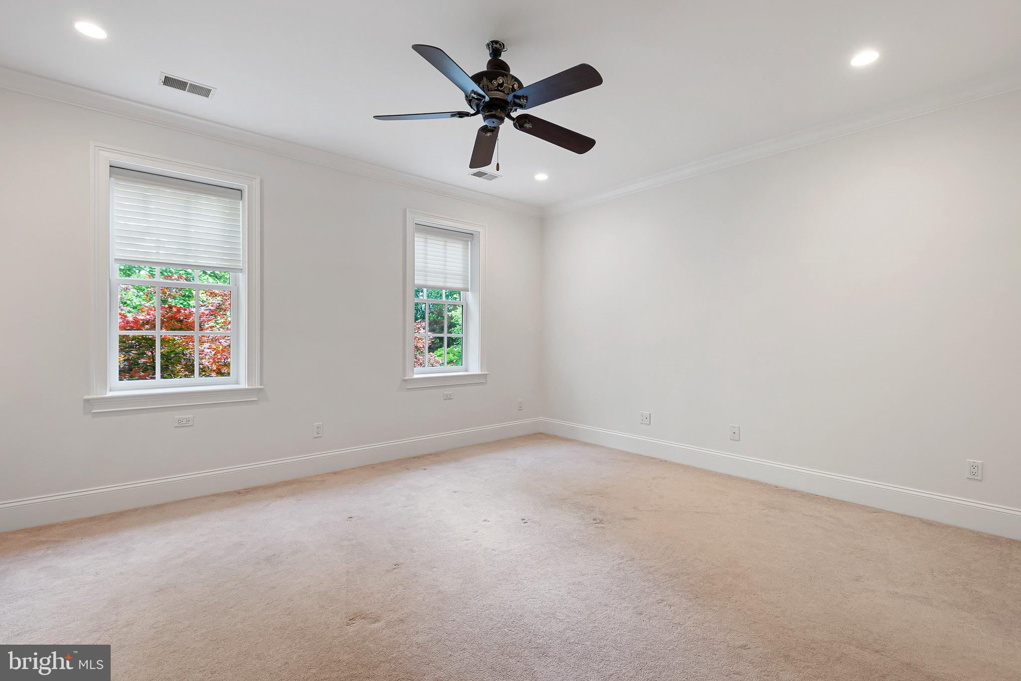 104 Timber Ridge Lane Chadds Ford, PA 19317 - Photo 40 of 65 an empty room with a window and a ceiling fan