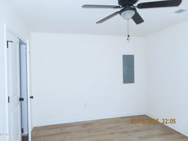 a view of an empty room with a window