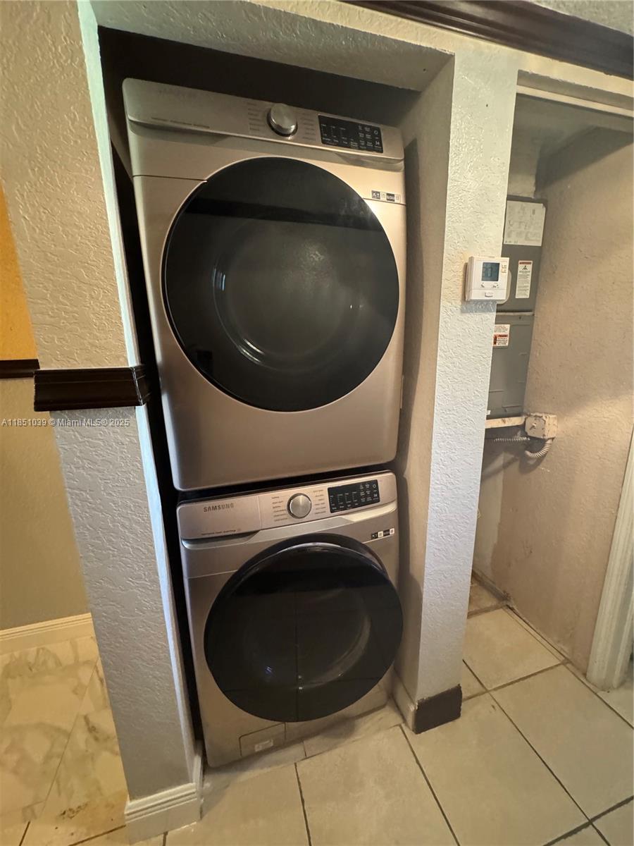 19550 Southwest 103rd Court, Unit 5 Cutler Bay, FL 33157 - Photo 18 of 28 a close up view of a washer and dryer