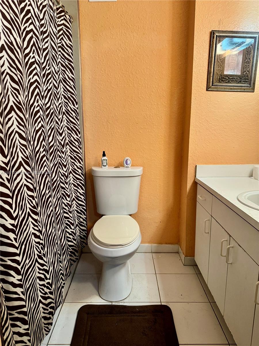 19550 Southwest 103rd Court, Unit 5 Cutler Bay, FL 33157 - Photo 28 of 28 a bathroom with a toilet and a sink