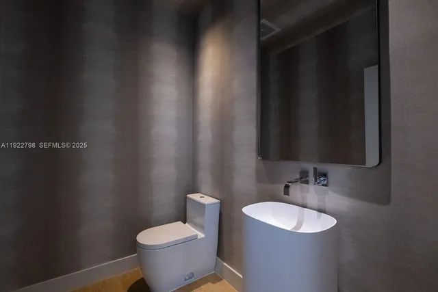 a bathroom with a sink and a toilet