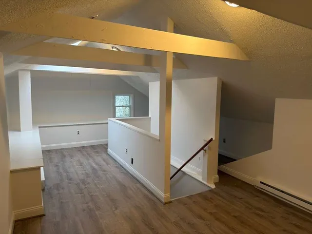 a view of a hallway with staircase