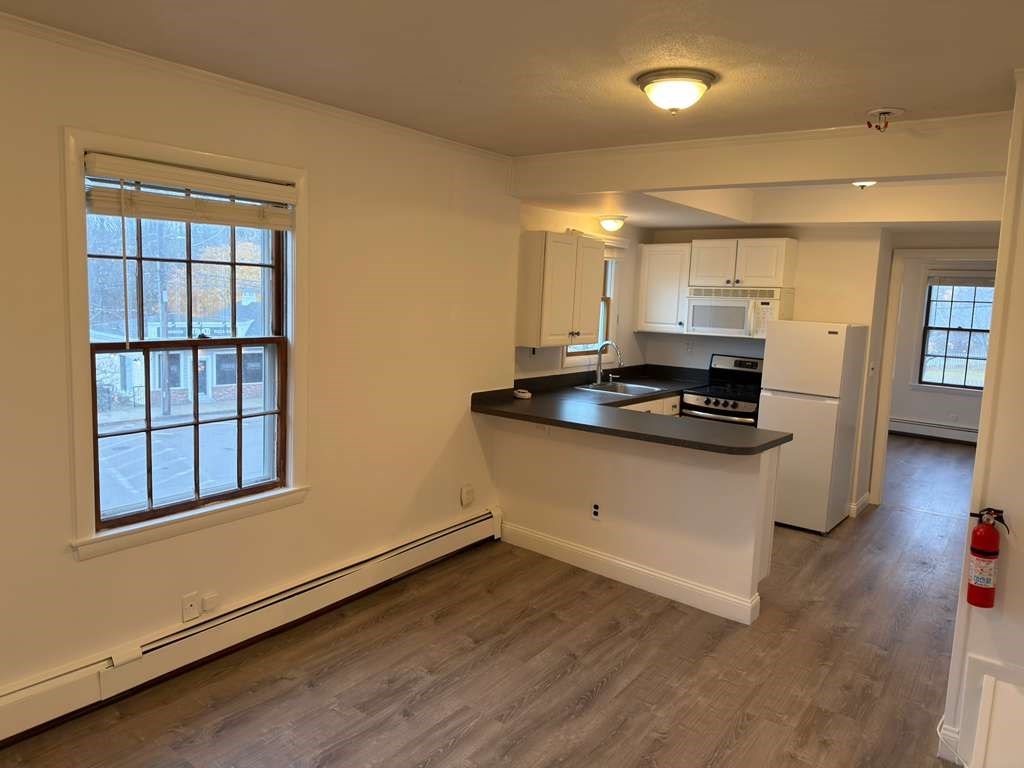 37 Exchange Street, Unit 37 Millis, MA 02054 - Photo 7 of 15 a kitchen with stainless steel appliances a stove a sink and a refrigerator