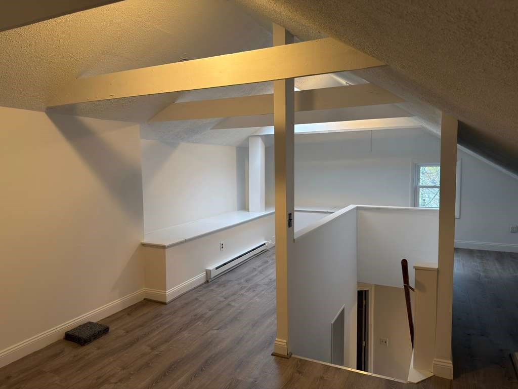 37 Exchange Street, Unit 37 Millis, MA 02054 - Photo 10 of 15 an empty room with wooden floor