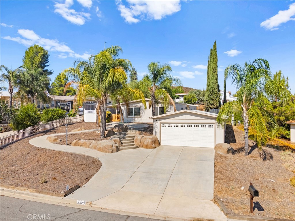 33653 Windmill Road Wildomar, CA 92595 - Photo 1 of 66 a view of a swimming pool with a patio