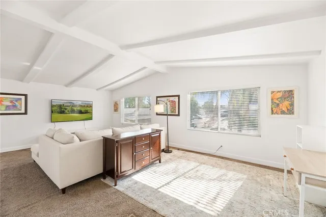 a living room with furniture and window