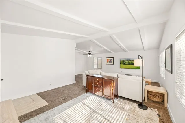 a living room with furniture and flat screen tv