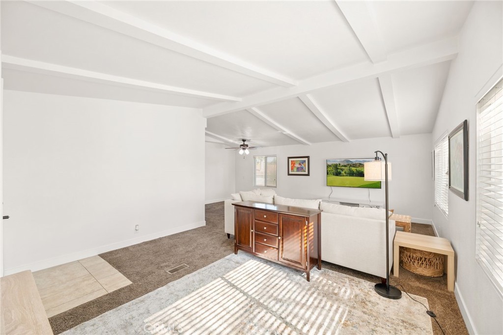 33653 Windmill Road Wildomar, CA 92595 - Photo 15 of 66 a room with furniture and painting on the wall