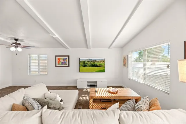 a living room with furniture and window