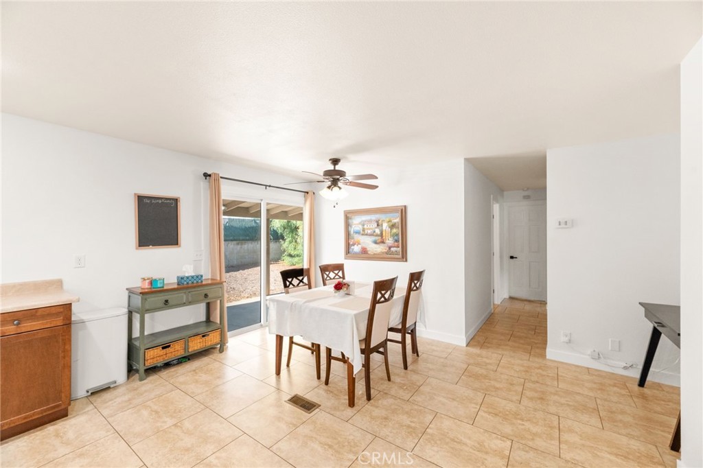 33653 Windmill Road Wildomar, CA 92595 - Photo 30 of 66 a living room with furniture and a flat screen tv